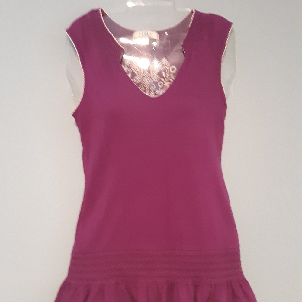 Purple tank top with a cream colored design on back